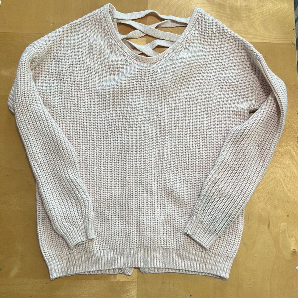 Pastel pink poof sweater with lace up back